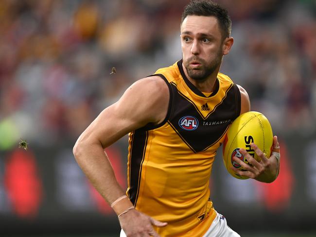 MELBOURNE, AUSTRALIA - APRIL 30: Jack Gunston of the Hawks looks to pass the ball during the round seven AFL match between the Melbourne Demons and the Hawthorn Hawks at Melbourne Cricket Ground on April 30, 2022 in Melbourne, Australia. (Photo by Quinn Rooney/Getty Images)