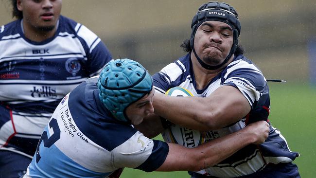 NSW Barbarians' Ben Park tackles Victoria's Valu Seinafo. Pic: John Appleyard