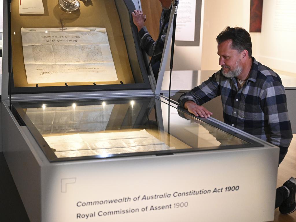 National Archives of Australia Communications officer Chris Downton with The Australian Constitution housed at National Archives of Australia in Canberra. Picture: NCA NewsWire / Martin Ollman