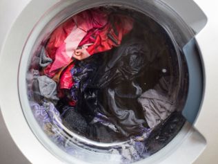 Overfilling the machine can leave the clothes damp or make the cycle run longer, so make sure you're buying the right size unit. Picture: iStock/z1b.