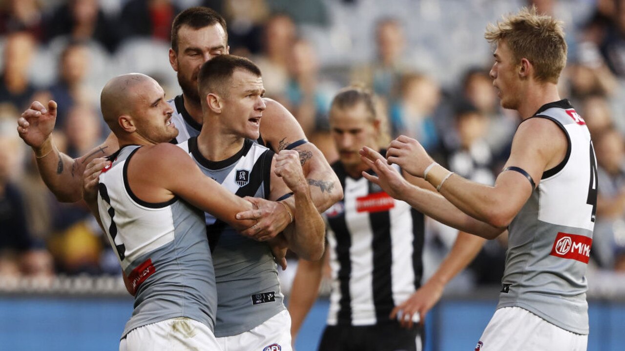 MELBOURNE, AUSTRALIA - MAY 23: Robbie Gray of the Power celebrates a goal with Sam Powell-Pepper of the Power, Charlie Dixon of the Power and Todd Marshall of the Power during the 2021 AFL Round 10 match between the Collingwood Magpies and the Port Adelaide Power at the Melbourne Cricket Ground on May 23, 2021 in Melbourne, Australia. (Photo by Dylan Burns/AFL Photos via Getty Images)