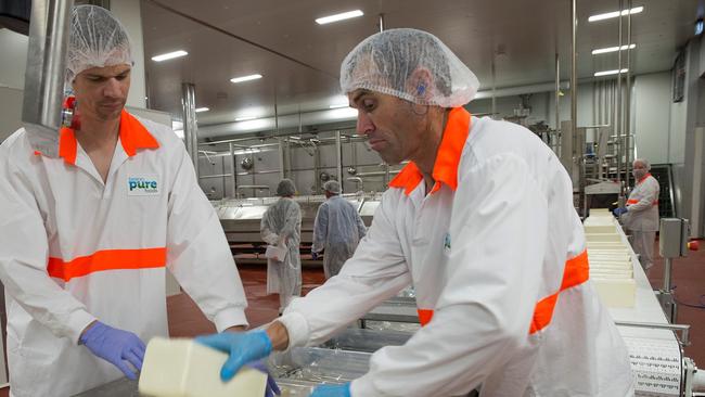 Packing mozzarella at the Beston cheese factory.