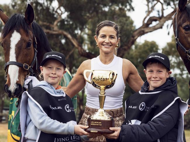 Michelle Payne with Rochester locals and Living Legends Twilight Payment and Prince of Penzance and this years trophy. Picture : Nicole Cleary