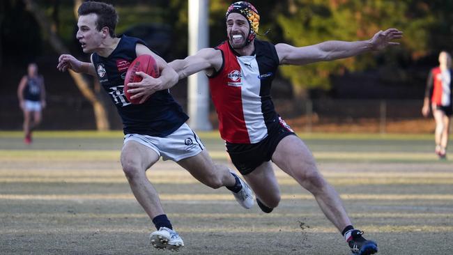 EFL: North Ringwood’s Michael Locco can’t catch Caleb Van Oostveen of Berwick. Picture: Valeriu Campan