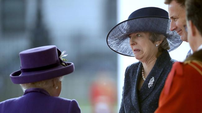 The Queen chats with Theresa May as they wait to greet Dutch King Willem-Alexander and his wife Queen Maxima, in London. Picture: AP