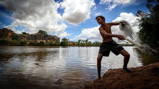 Shanen Gardner, 14, casts a net at Geike Gorge on the Fitzroy River. ‘Barramundi is my favourite,’ he says. Picture: Colin Murty