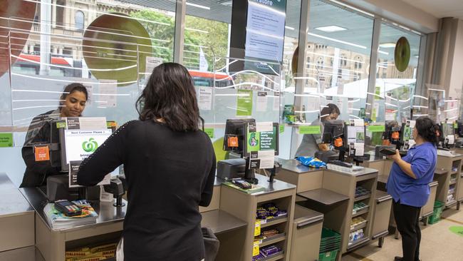 Woolworths has introduced plexiglass screens across its supermarket network to protect workers from being exposed to COVID-19. Picture: Dallas Kilponen