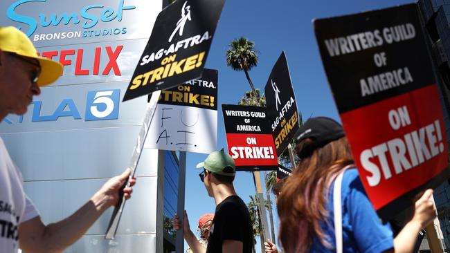 Striking SAG-AFTRA members picket with WGA workers outside Netflix offices in LA. Picture: Mario Tama/Getty Images