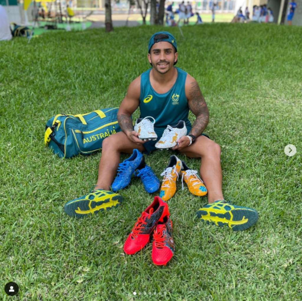 Maurice Longbottom with his indigenous artwork footy boots