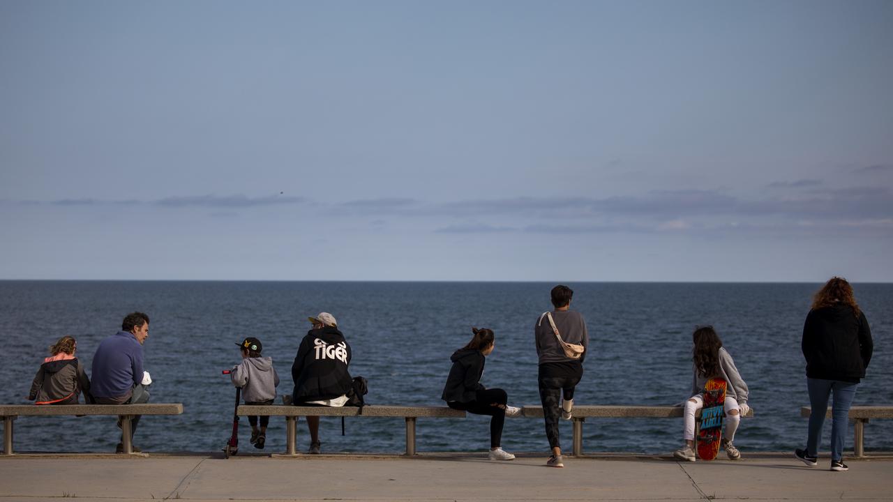 People look at the Mediterranean Sea in Barcelona, Spain on Sunday, April 26, 2020. Emilio Morenatti/AP