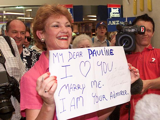 Pauline Hanson at Australia Fair Shopping Centre holding a supporters placard in 2001.