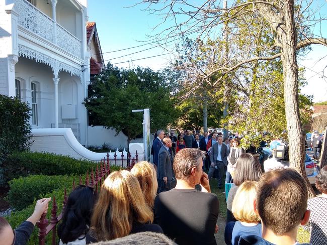 Auctioneer Ricky Briggs at the sale of 58 Myrtle St, Stanmore. NSW real estate.