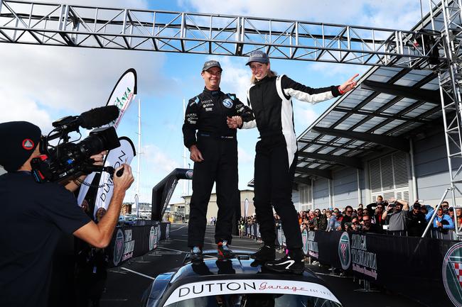 Winners Paul Stokell and Kate Catford on the roof of the car. Finish of Targa Tasmania 2019 at Macquarie Wharf shed no. 2. Picture: NIKKI DAVIS-JONES