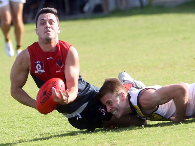 Round 4 QAFL Australian rules game between Surfers Paradise Demons (blue) and Labrador Tigers at Sir Bruce Small Park. Photo of Dane Watmuff (right) and Dylan Mutu. Photo by Richard Gosling