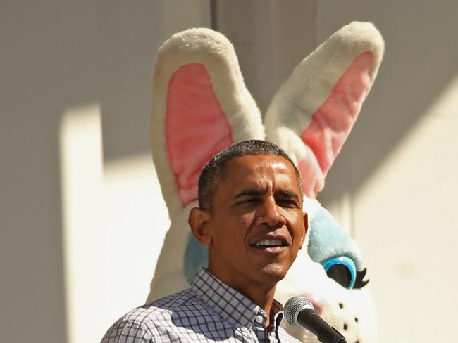 President Barack Obama delivers opening remarks from the Truman Balcony as a person dressed as the Easter Bunny stands behind him during the White House Easter Egg Roll on the South Lawn of the White House April 6, 2015. Picture: Chip Somodevilla/Getty Images