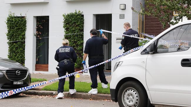 Police outside Karl Howard’s Annandale home on Monday. Picture: Richard Dobson