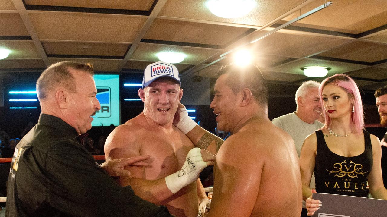 Paul Gallen and Herman Ene-Purcell fight it out in Toowoomba. Friday, Jan 29, 2016.