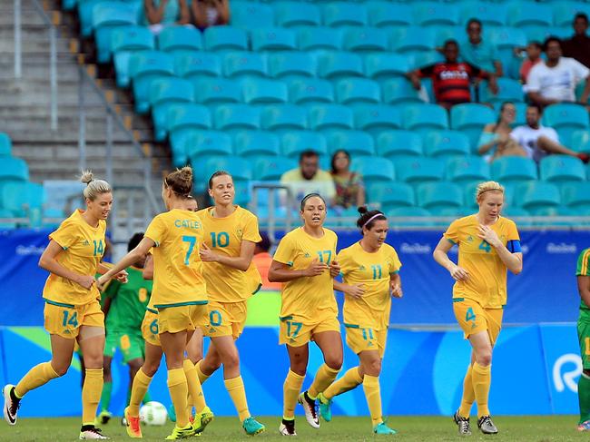 SALVADOR, BRAZIL - AUGUST 09: Kennedy of Australia celebrates with teammates after scoring a goal during the match between Australia and Zimbabwe at the Rio 2016 Olympic Games at Arena Fonte Nova on August 9, 2016 in Salvador, Brazil. (Photo by Felipe Oliveira/Getty Images)