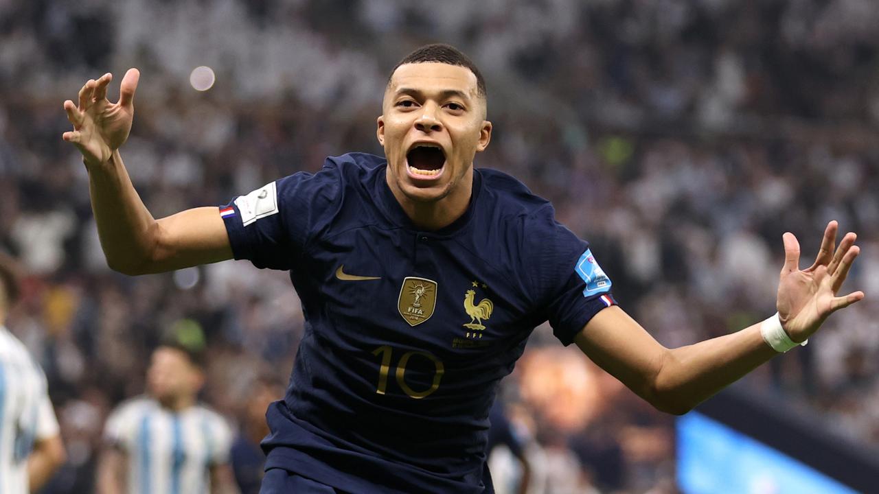 Kylian Mbappe of France celebrates after scoring the team's second goal during the 2022 FIFA World Cup final against Argentina. (Photo by Catherine Ivill/Getty Images)