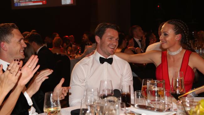 Dangerfield is congratulated by his wife Mardi and teammate Joel Selwood. Picture: Wayne Ludbey.