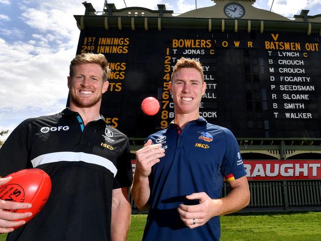 Footballers Tom Jonas from Port Adelaide Football Club and Tom Lynch from the Adelaide Crows who will both captain their respective sides in the Bushfire appeal T20 cricket game which will at Adelaide Oval. (AAP Image/Sam Wundke)