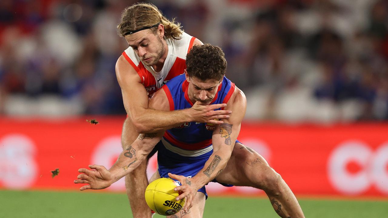 Tom Liberatore of the Bulldogs is challenged by James Rowbottom of the Swans. Picture: Robert Cianflone