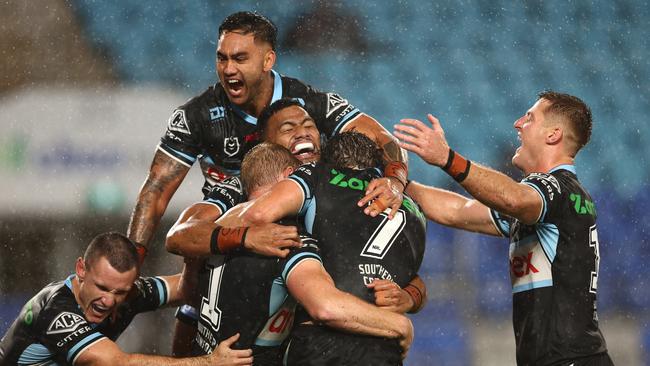 Lachlan Miller of the Sharks celebrates a try. Photo by Chris Hyde/Getty Images