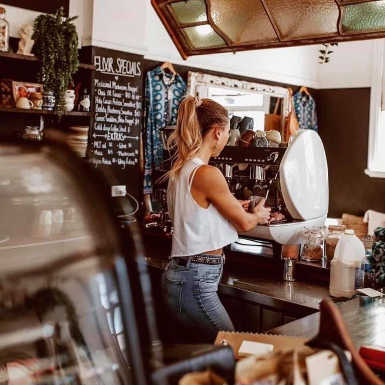 COFFEE HIT: Jame Straker prepares a take-away order in the espresso bar at Gypsy N Folk.