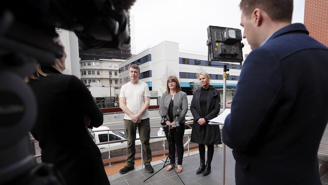 State Opposition health spokeswoman Sarah Lovell, centre, with hospital patient Brent Gray, left, and Katie Gray, whose brother was recently a patient at the Royal Hobart Hospital, launching a petition calling for Health Minister Michael Ferguson to be replaced. Picture: RICHARD JUPE