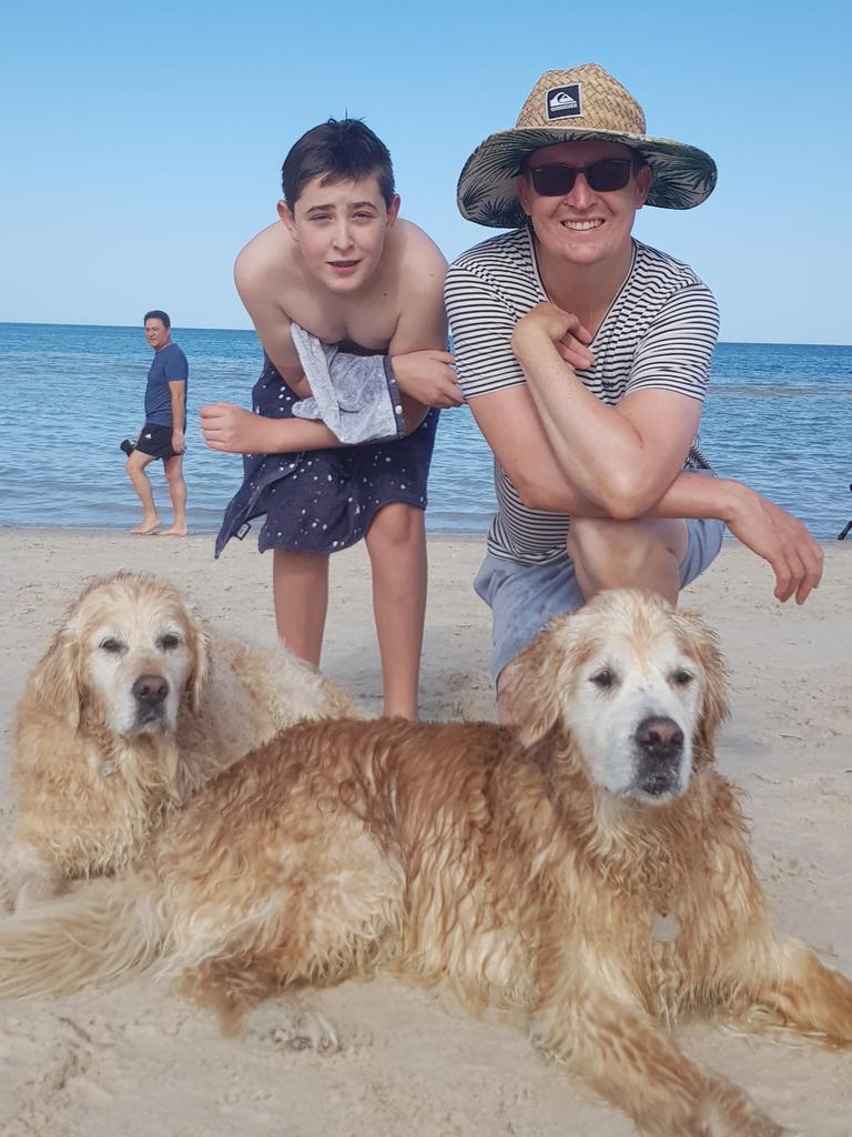 Lea’s husband and son with the family’s two dogs. Picture: Supplied 