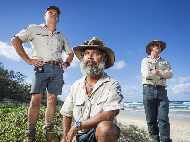 Fraser Island QPWS rangers Jason Kellam, Darren Blake and Daniel Clifton are educating visitors about dingo safety after the attacks. Picture: Lachie Millard