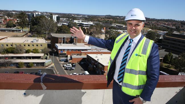 Harcourts real estate agent Garth Makowski atop Campbelltown’s tallest building — Phillip Square. Picture: Robert Pozo