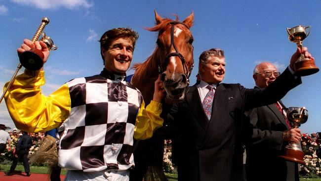 Darren Beadman and trainer Bart Cummings with Saintly at the 1996 Melbourne Cup race presentation.