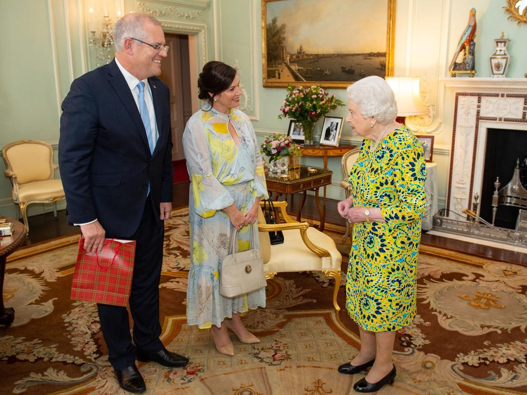 Britain's Queen Elizabeth II (R) greets Australia's Prime Minister Scott Morrison (L), and his wife Jenny, during an audience at Buckingham Palace in London on June 4, 2019.