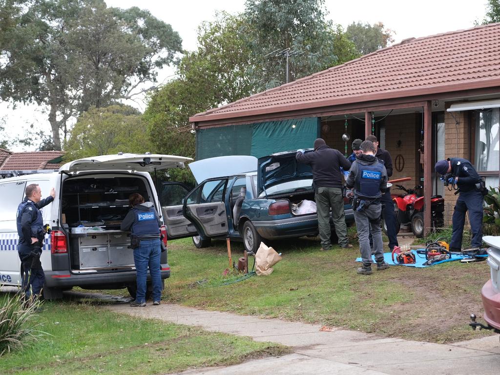 Police inspect the West Wodonga home. Picture: Simon Dallinger