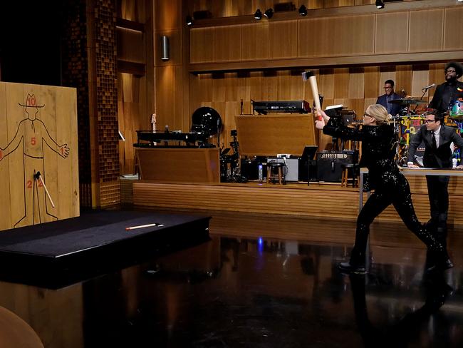 The always game Jennifer Lawrence and host Jimmy Fallon throw axes during a segment on The Tonight Show Starring Jimmy Fallon in New York this week. Picture: Jamie McCarthy/Getty Images