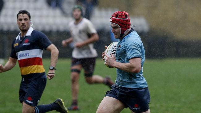 NSW's Harry Davis on his way to a try during the championships.