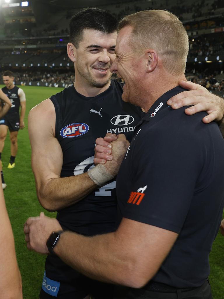 Matthew Kennedy hugs Michael Voss. Pic: Michael Klein.