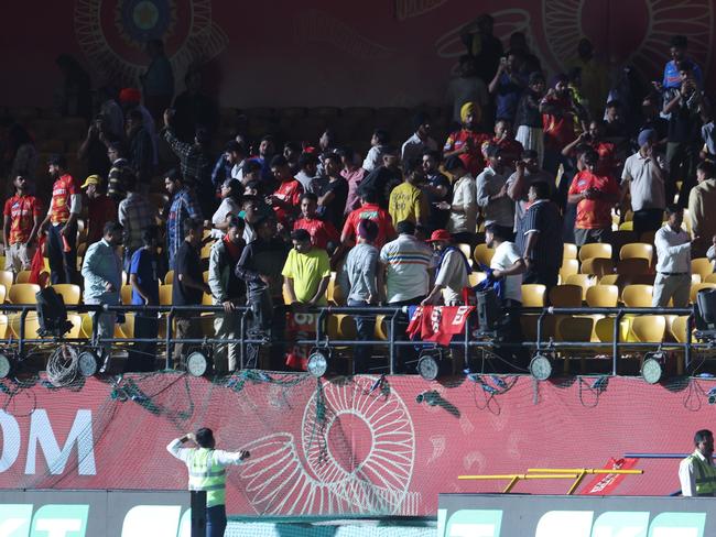 Spectators leave the stands after authorities evacuated the stadium between Punjab Kings and Delhi Capitals in Dharamsala. Picture: Pankaj Nangia/Getty Images