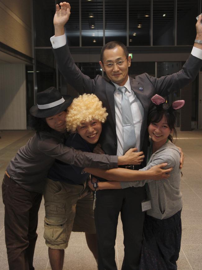 Nobel prize laureate in medicine Shinya Yamanaka, center right, is congratulated by costumed researchers and students of his laboratory at Kyoto University following the announcement of his award winning. Picture: AP Photo/CiRA