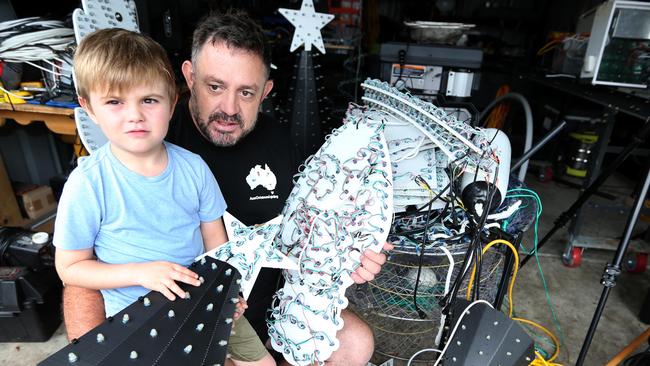 Mr Martin Skok and his 5 year old son Cooper Martin is one of the finalists in our Christmas lights competition had his display destroyed.Picture Mike Batterham