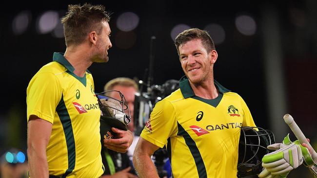 Andrew Tye and Tim Paine walk off after a much-needed win over England. Picture: Getty