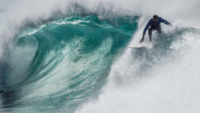 TOTALLY GNARLY: Surfing is quite possibly the most dangerous sport in the world, but that doesn’t seem to stop people searching for the perfect wave. Photo: Gary Nichols