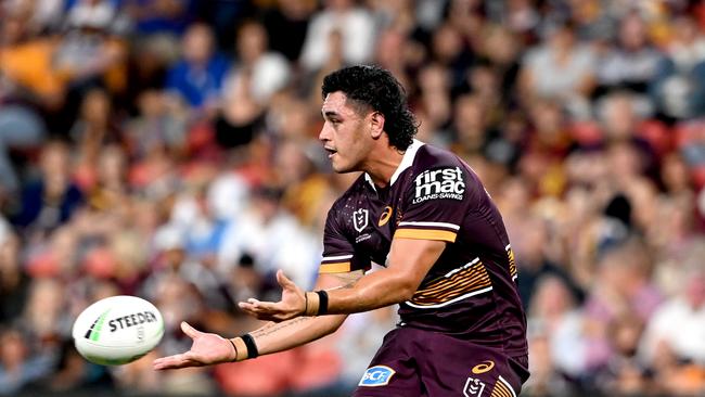 BRISBANE, AUSTRALIA – APRIL 22: Keenan Palasia of the Broncos passes the ball during the round seven NRL match between the Brisbane Broncos and the Canterbury Bulldogs at Suncorp Stadium, on April 22, 2022, in Brisbane, Australia. (Photo by Bradley Kanaris/Getty Images)