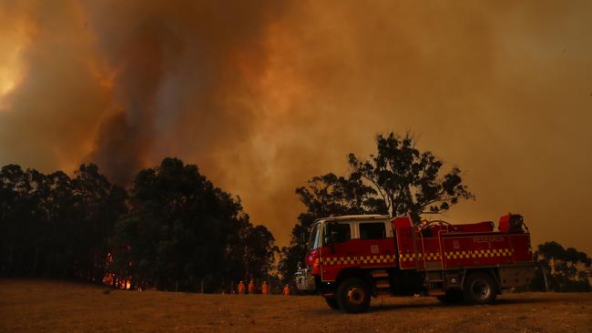 CFA members battle the bushfire in Bunyip State Park. Picture: Alex Coppel