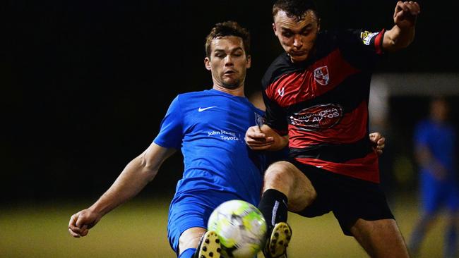 Noosa's Matt Thompson and Caloundra's Michael Bird go toe to toe for the ball.