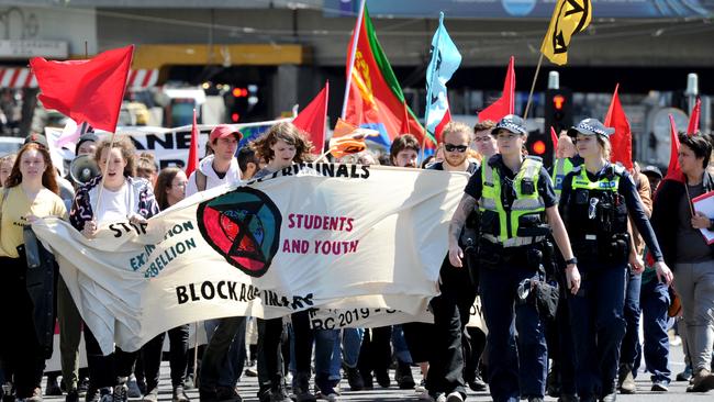 Protestors march through the city in opposition to the International Mining &amp; Resources Conference at the Melbourne Convention Centre. Picture: Andrew Henshaw