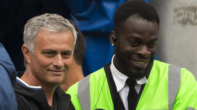 Manchester United manager Jose Mourinho shakes hands with a steward.