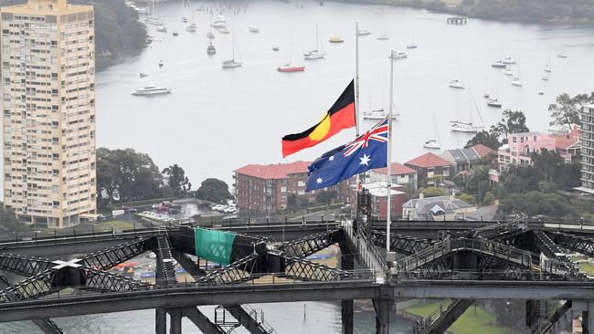 The Australian national flag and the Aboriginal flag on the Sydney Harbour Bridge. Picture: Getty Images.