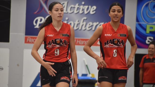 (From left) Cheyenne Bobongie and Isabel Smith for the Mackay Meteorettes in the U14 State Championship final against Cairns Dolphins in Mackay. Picture: Matthew Forrest